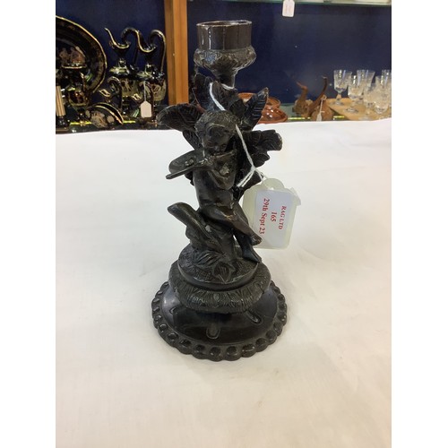 165 - A bronze cherub decorated candlestick