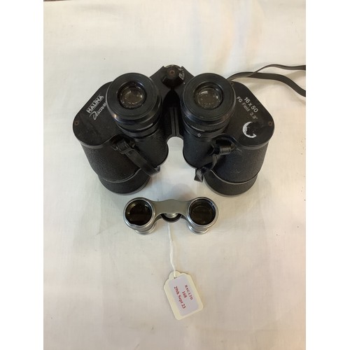 168 - A pair of Halina 16 x 50 field binoculars together with a pair of opera glasses