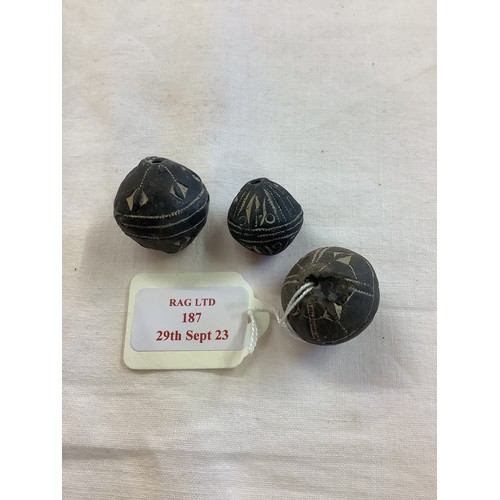 187 - Three medieval Mali terracotta spindle whorls with etched decoration