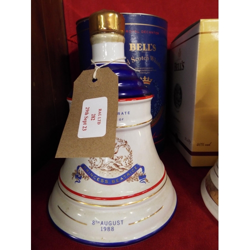 282 - A unopened Bells Whisky decanter commemorating the birth of Princess Beatrice 1988 housed in a tin