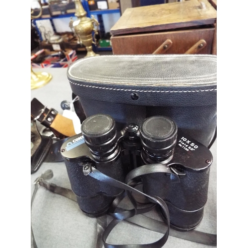 311 - A pair of Commodore 10 x 50 field 5:5 binoculars in leather carry case