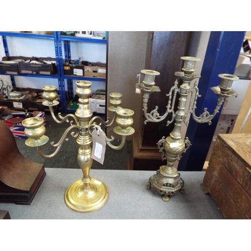 313 - Two ornate brass candelabras