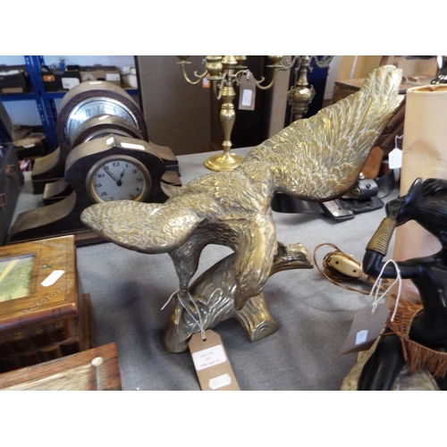 315 - A vintage large brass eagle resting on a branch figurine