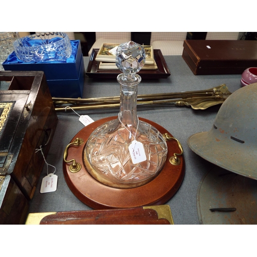 340 - A glass ships decanter on a stand with brass handles