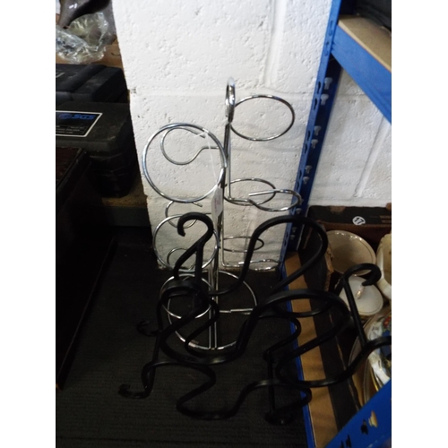 415 - A wrought iron wine rack together with a stainless steel wine rack