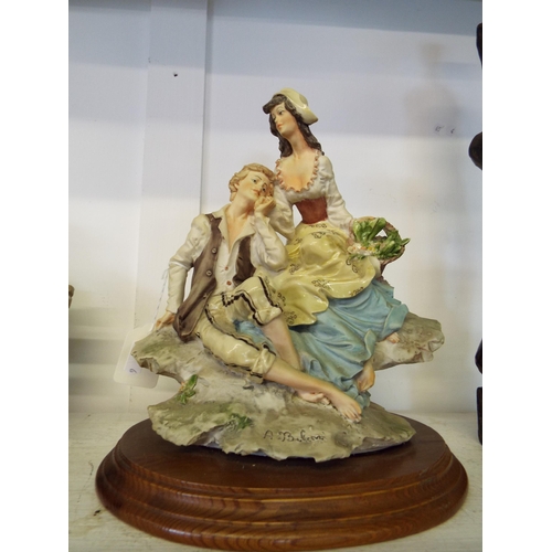 444 - A signed Capodimonte figural group of a courting couple