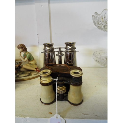 448 - Two pairs of vintage opera glasses together with a chrome pair