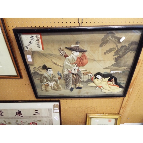 490 - A late 19thC framed Oshi-E tapestry depicting figures in the garden made from old kimonos, signed an... 