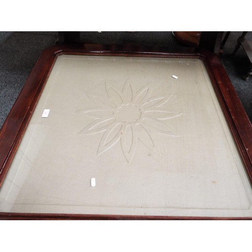 601 - A large glass topped stained wood coffee table