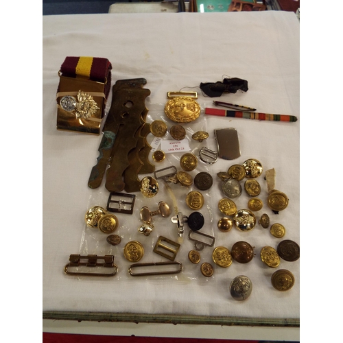 151 - A mixed selection of Military items to include belts, buckles, buttons etc