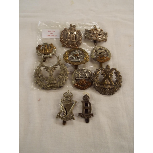 161 - A selection of Military cap badges to include Cameron, Egypt, Hampshire etc