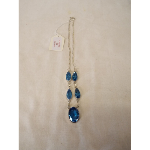 222 - A silver necklace inset with blue topaz