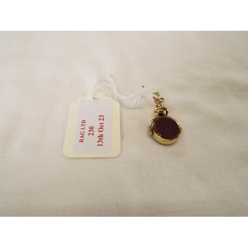 230 - A gold agate set spinning fob