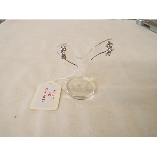 242 - A pair of silver earrings inset with cubic zirconia