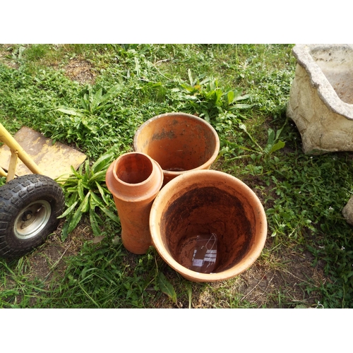 245 - Two terracotta garden pots and a terracotta chimney pot