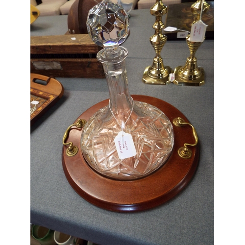 274 - A glass ships decanter on a stand with brass handles