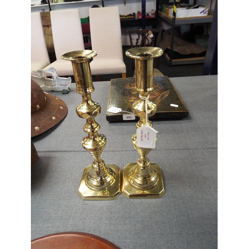 275 - A pair of brass candlesticks