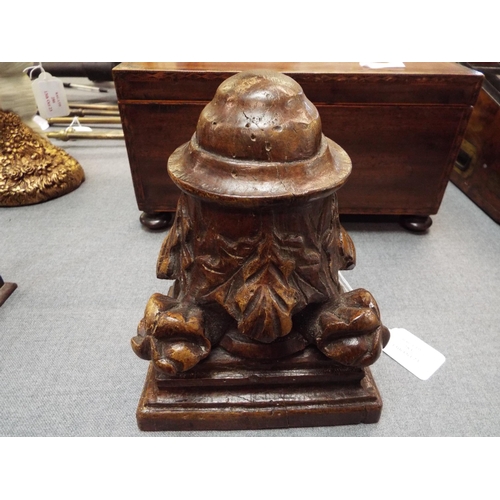 283 - An antique carved oak wall bracket