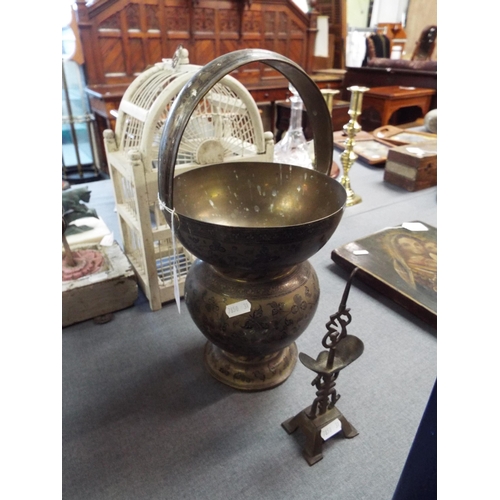 296 - An Oriental incense basket and a brass figure