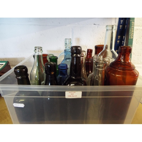 319 - A mixed selection of vintage glass bottles