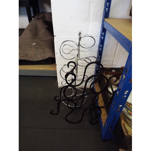 329 - A wrought iron wine rack together with a stainless steel wine rack