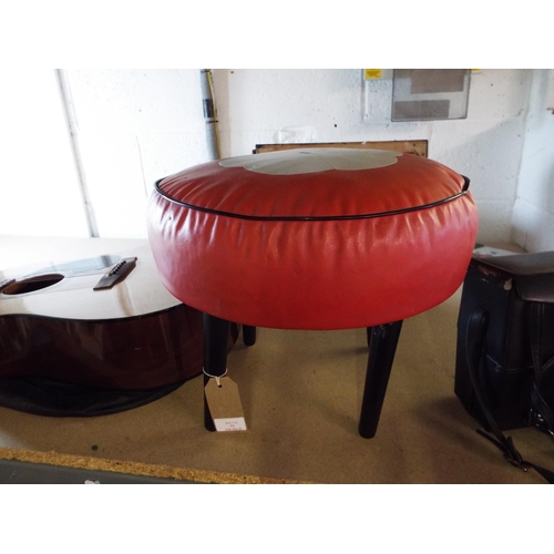 331 - A vintage red, cream and black leather pouffe having floral decoration