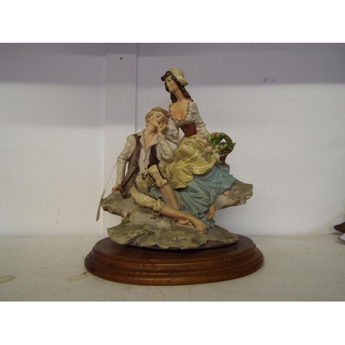 347 - A signed Capodimonte figural group of a courting couple