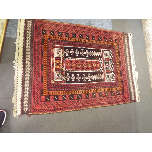 405 - A vintage red ground rug