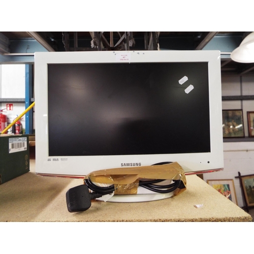 407 - A Samsung TV monitor with remotes