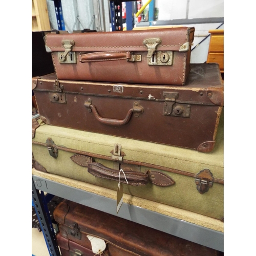 411 - Three vintage leather and cloth suitcases