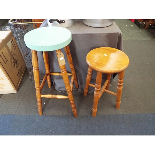 482 - A pine stool with green painted top together with another