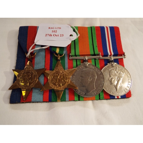 102 - A group of medals to include the 1939-1945 star, Pacific Star, Defence Medal and Victory Medal