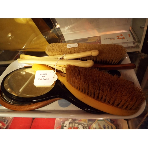 124 - A mixed selection to include brushes, mirrors, glove stretchers etc