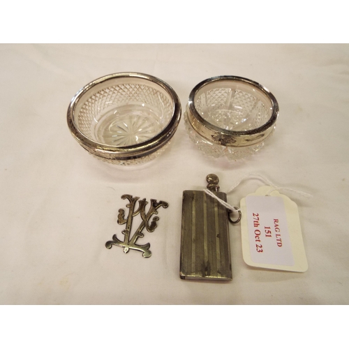 151 - Two silver rimmed glass pin dishes, white metal vesta and a white metal V