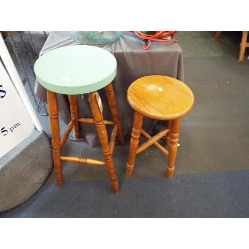 487 - A pine stool with green painted top together with another