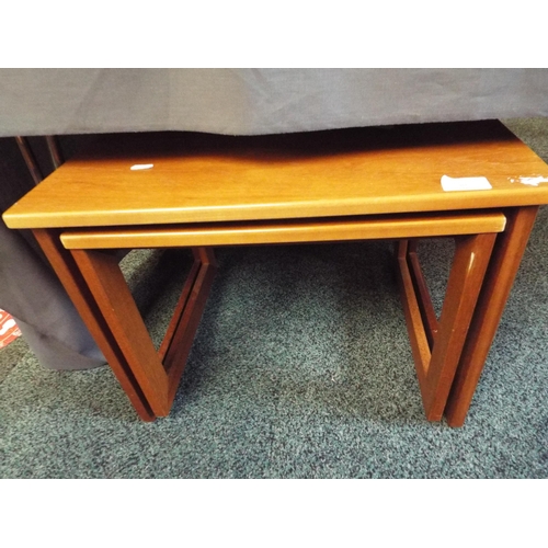 465 - A nest of two teak side tables