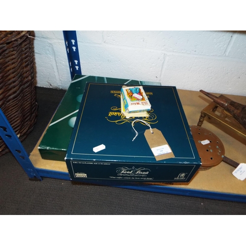 388 - A boxed Table Tennis set, Trivial Pursuit and cards