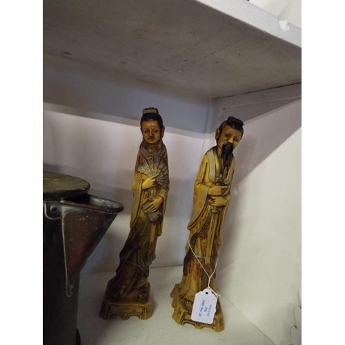396 - A pair of Oriental resin figures