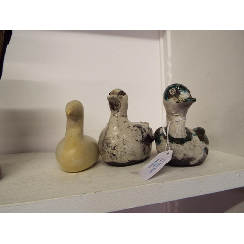 402 - A soapstone figurine of a bird together with two pottery birds