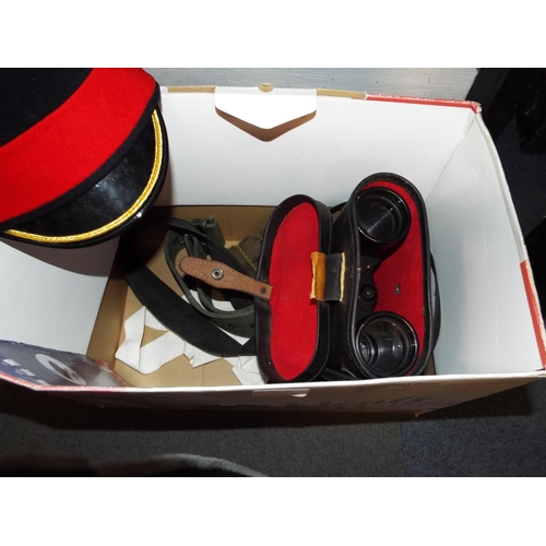 412 - A mixed selection of military items to include a pair of binoculars etc