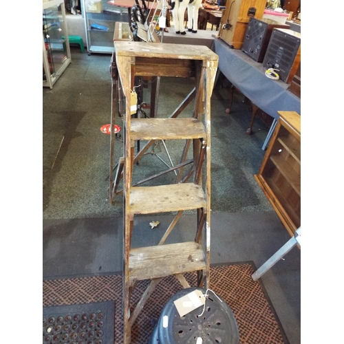 622 - A vintage pair of wooden step ladders