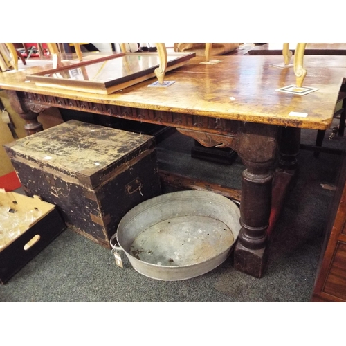 615 - An antique oak refectory table with loose top and stretcher supports