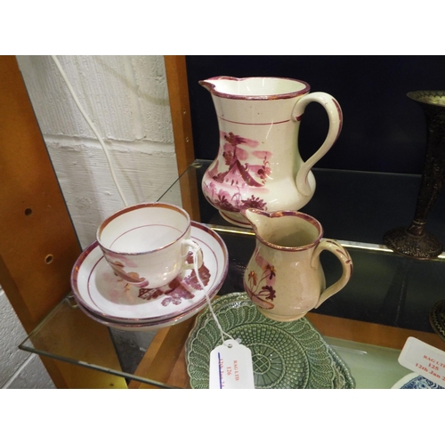 126 - A Sunderland lustre water jug, cream jug, a cup and two saucers