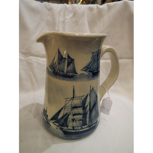 13 - A Richard Horner Iden Pottery water jug with blue and white clipper decoration