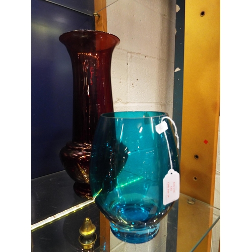 132 - A cranberry coloured vase and a green coloured vase