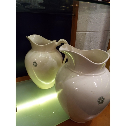 140 - Two cream ground Cetem ware water jugs