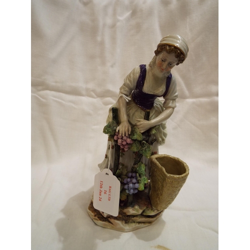 16 - A very good quality Continental figurine of a young female in period costume picking fruit