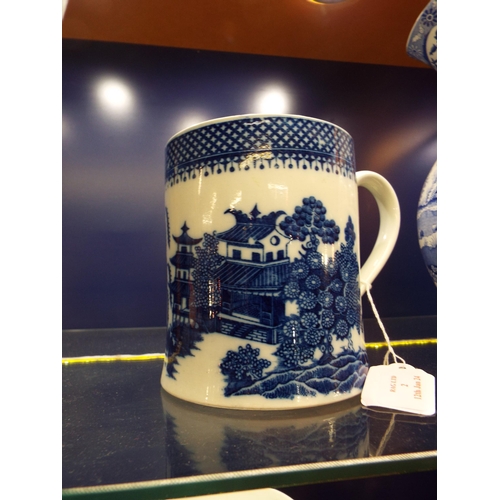 2 - A Chinese Canton late 18thC early 19thC blue and white tankard with pagoda decoration (hairline crac... 