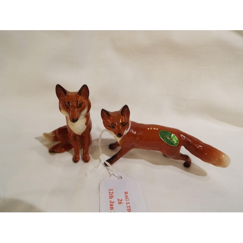 26 - Two Beswick foxes one seated the other running