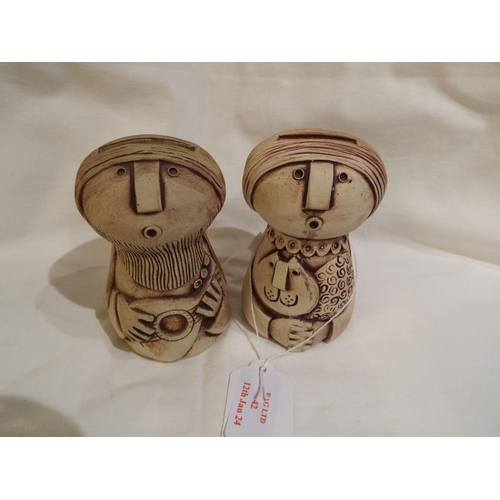 42 - A pair of Iden Pottery figural money boxes